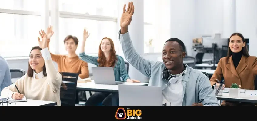 Presentation, Convention Concept. Portrait of smiling international people participating in seminar at modern office, raising hands up to ask question or to volunteer, diverse group sitting at tables