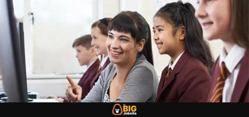 Pupils In Computer Class With Teacher