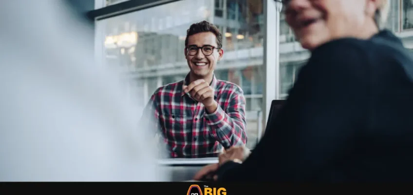 person in office environment looking happy